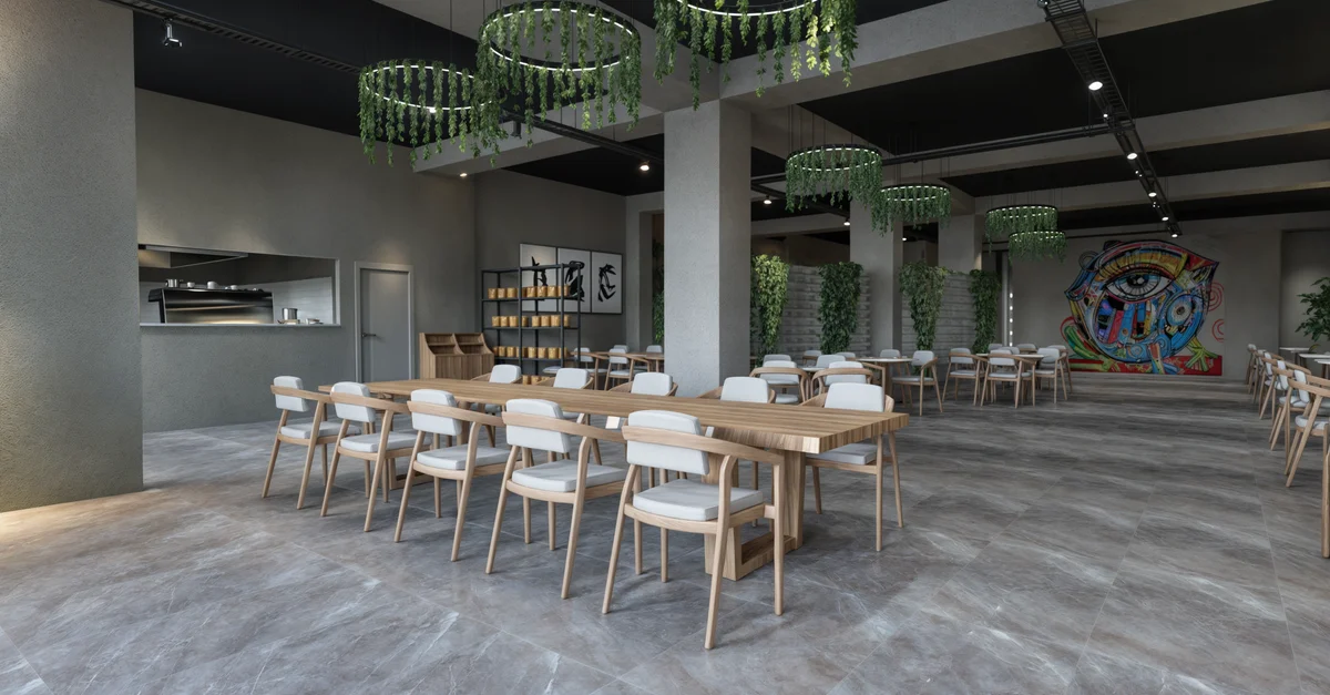 Interior de restaurante moderno y espacioso con muebles minimalistas y decoración de pared artística.